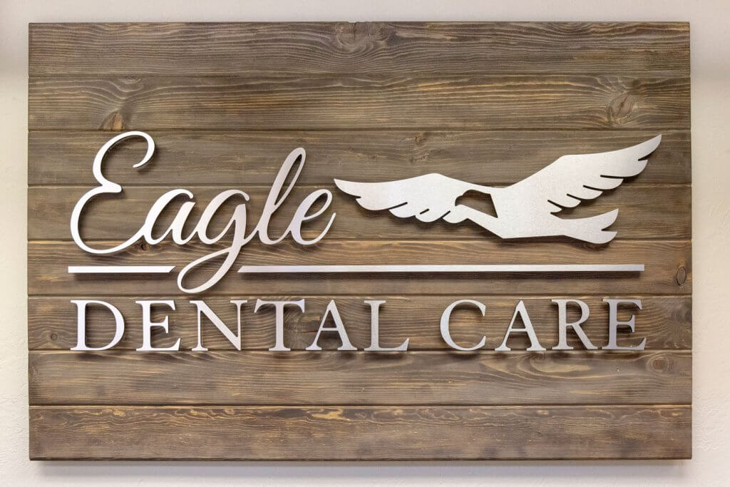 Wooden plaque with Eagle Dental Care logo